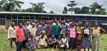 Large community group photographed together outdoors